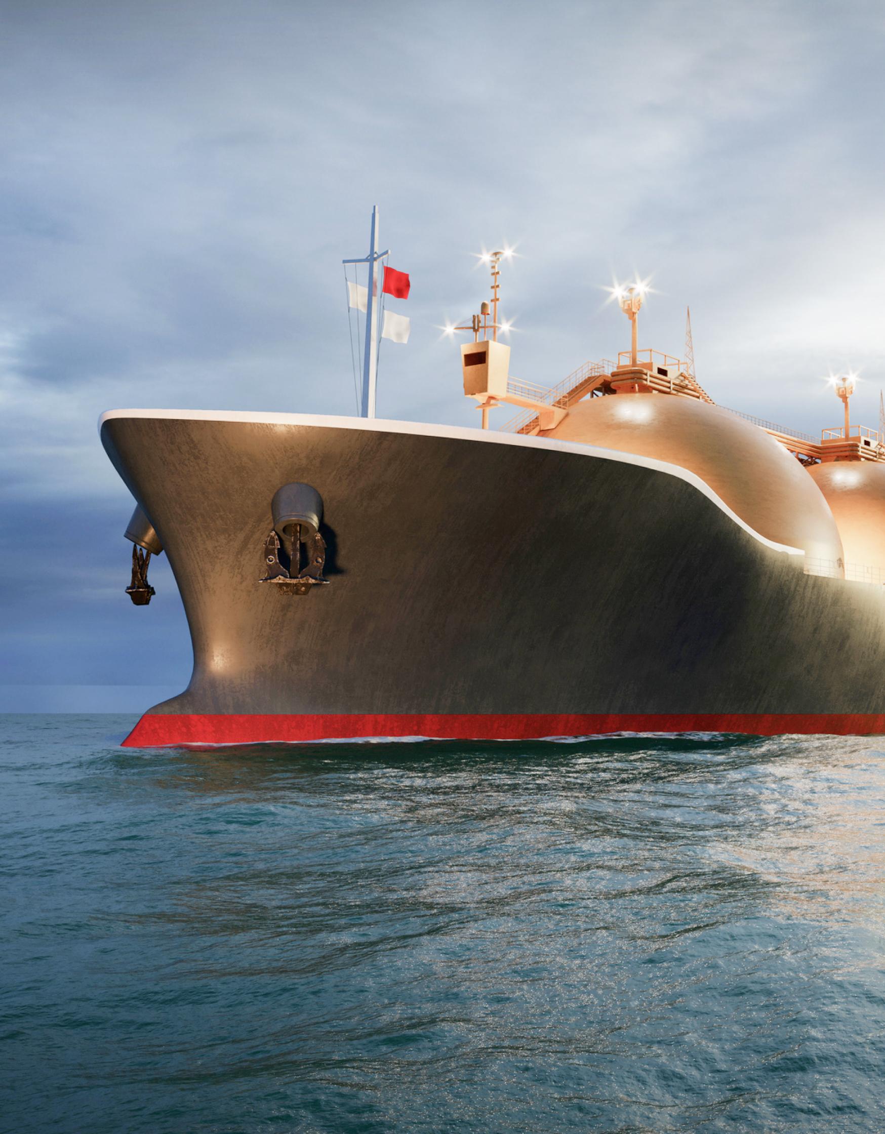 Oil and gas tanker sailing in ocean at night.