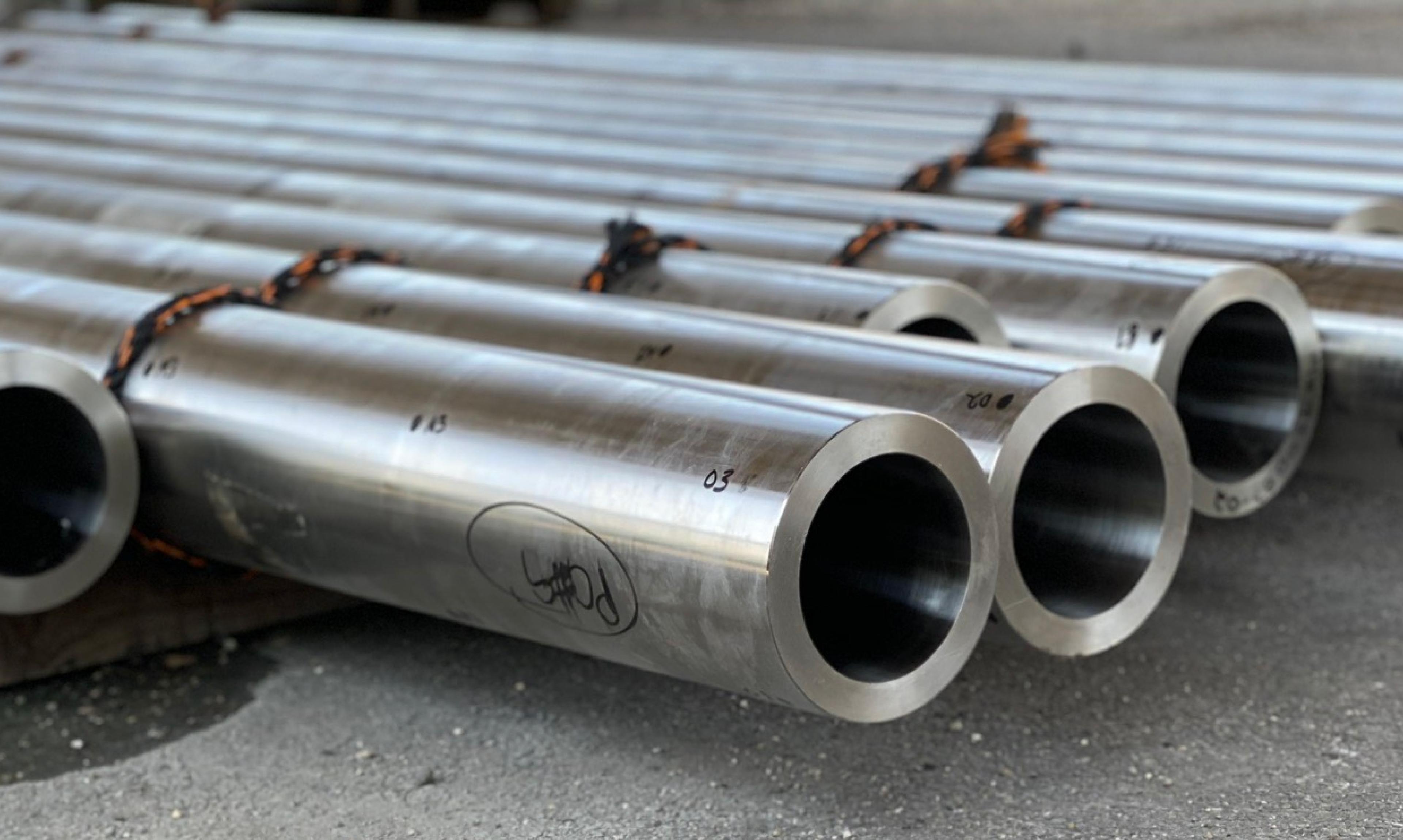 Steel pipes laying on the floor.