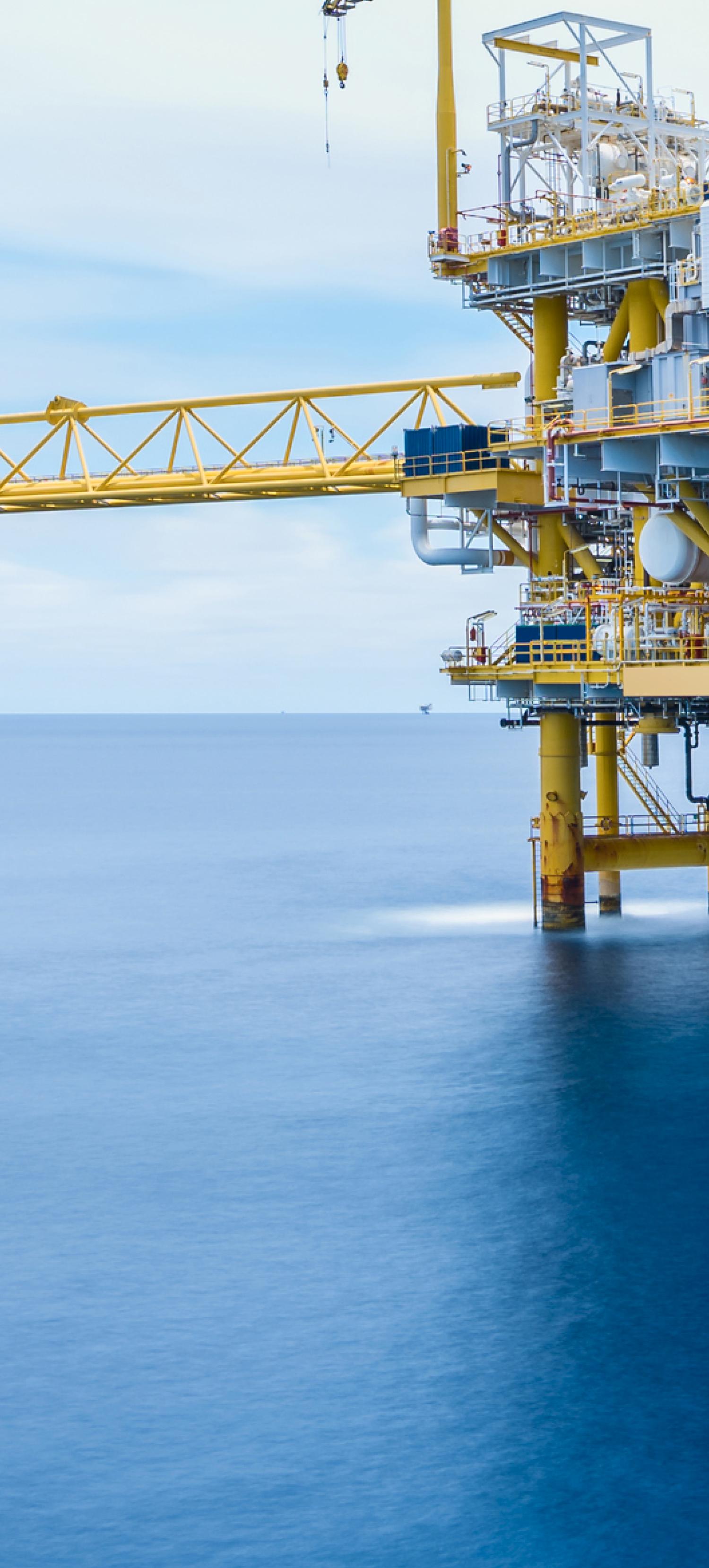 An offshore rig with blue ocean in the background